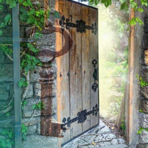 An open wooden door with light shining behind it and green leaves around the door and the text “Spiritual Keys to Aging Well”