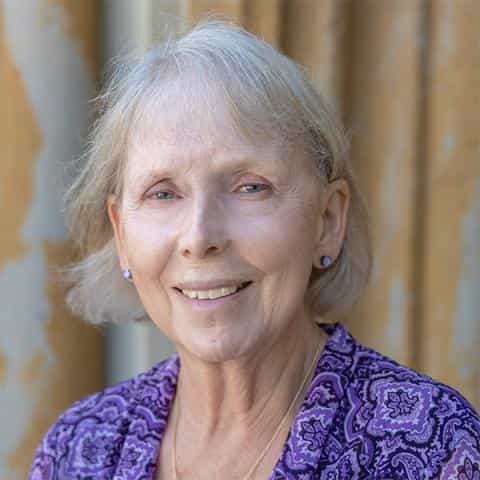 Headshot of Sharon Sartin in front of an exterior wall at Unity Village